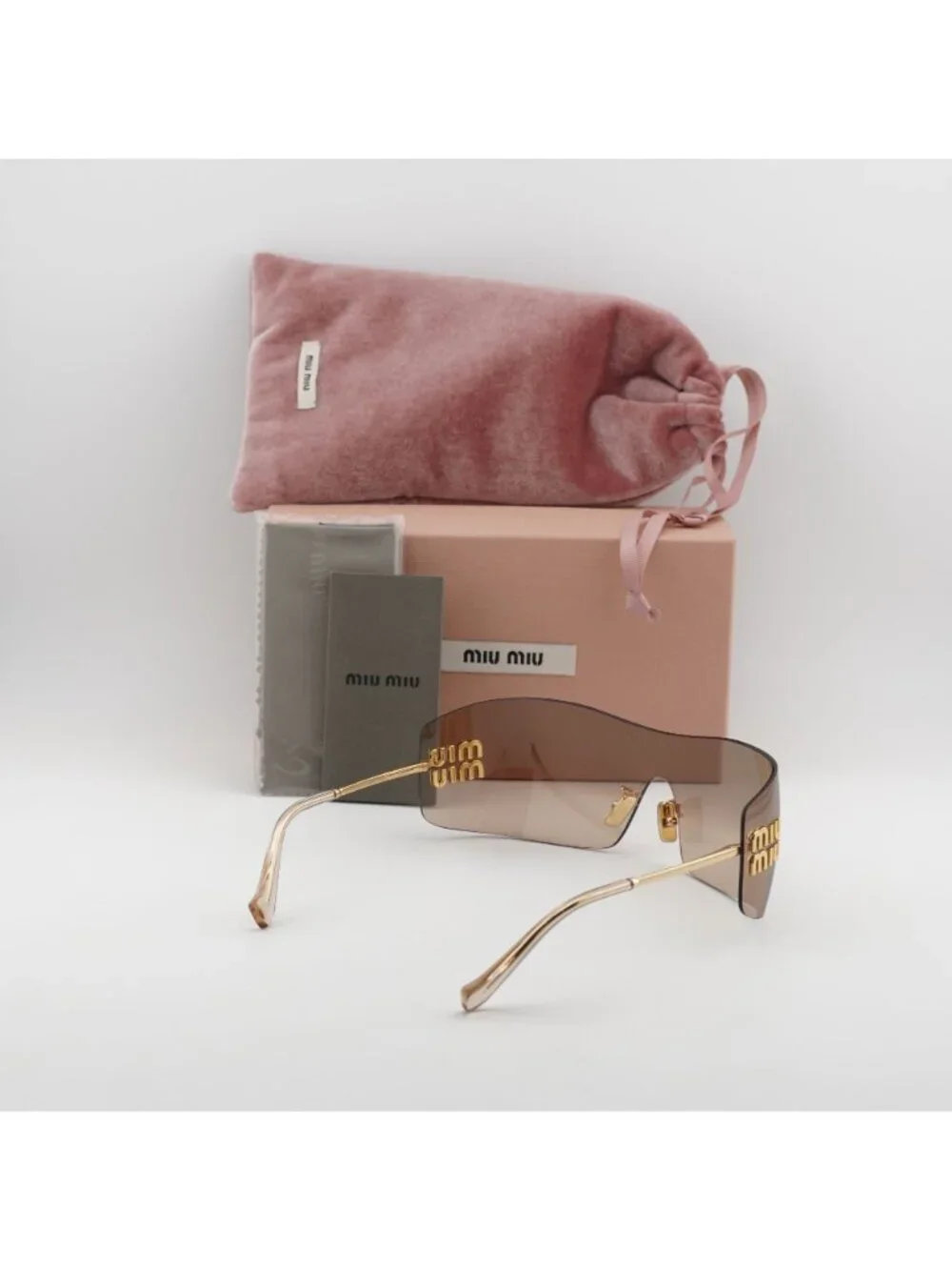 Miu Miu MU B53S 5AK20P Sunglasses Gold Shield Frame, Light Brown Lenses